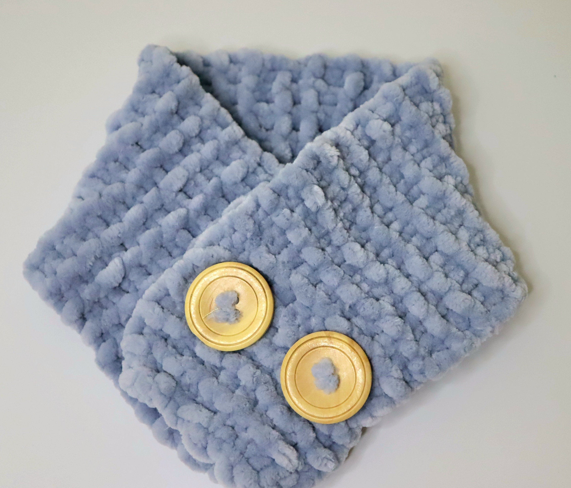 Photo of a blue knitted scarf